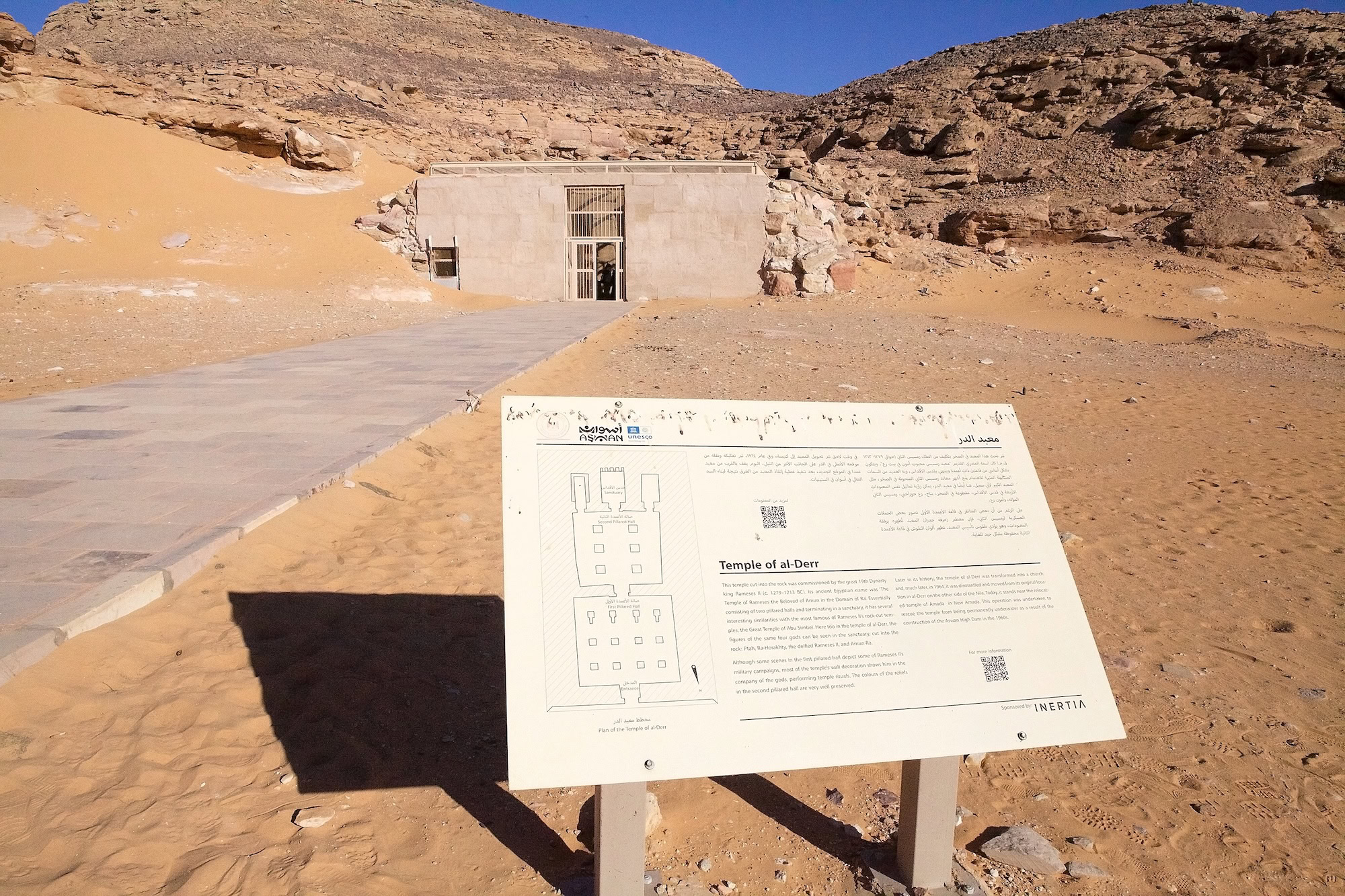 Temple of Derr entrance with information board in Egyptian desert landscape