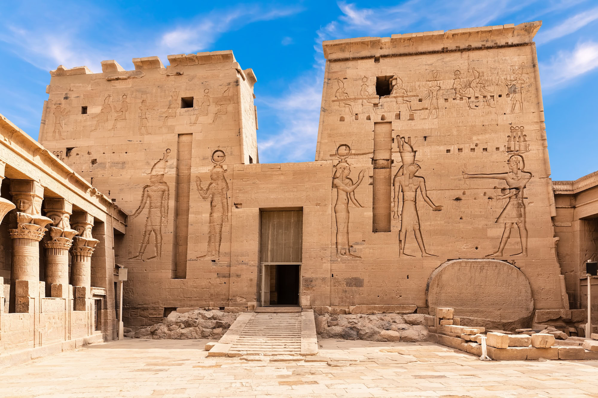 Ancient Philae Temple courtyard showing detailed hieroglyphic carvings on stone columns and walls