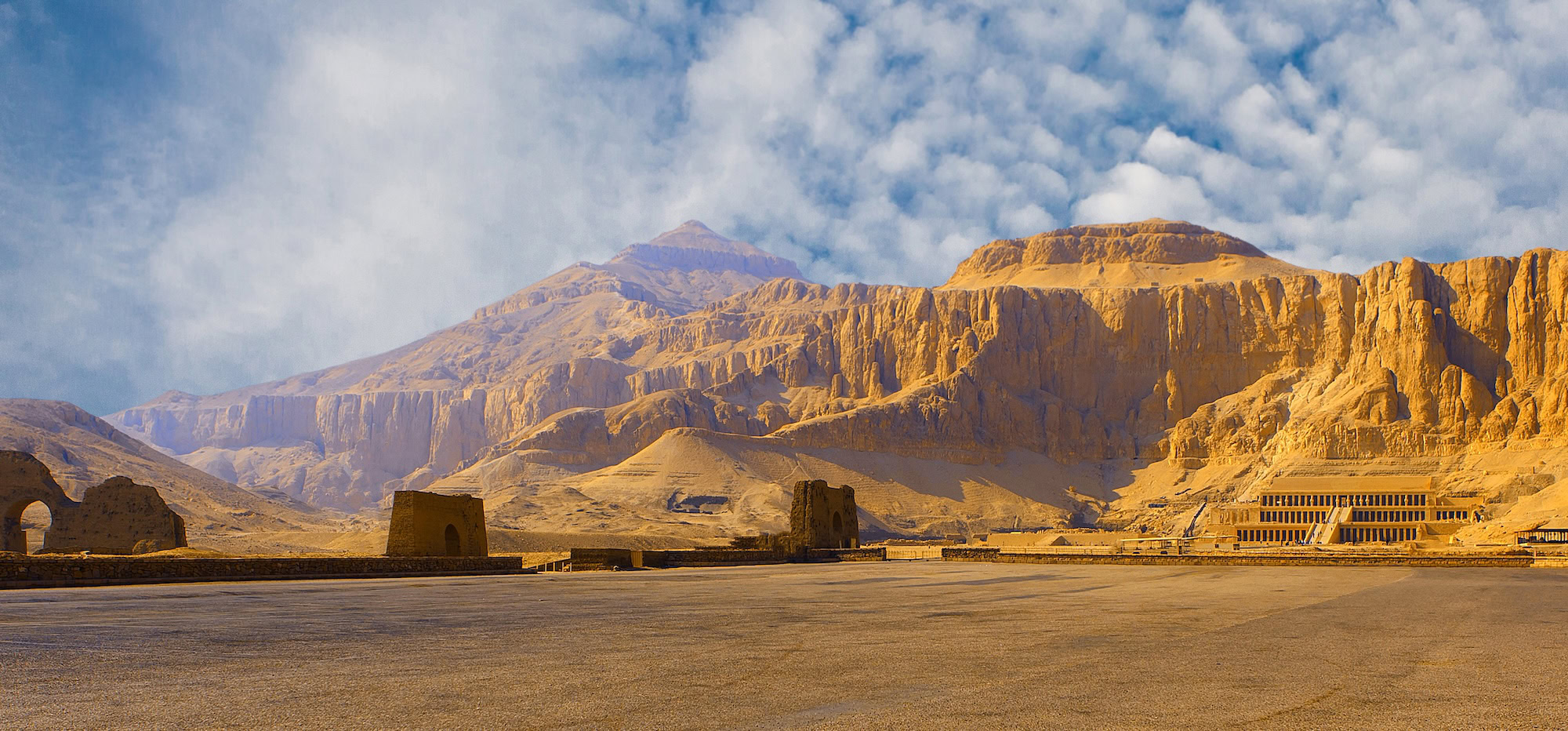Mortuary Temple of Queen Hatshepsut with terraced architecture against limestone cliffs in Egypt