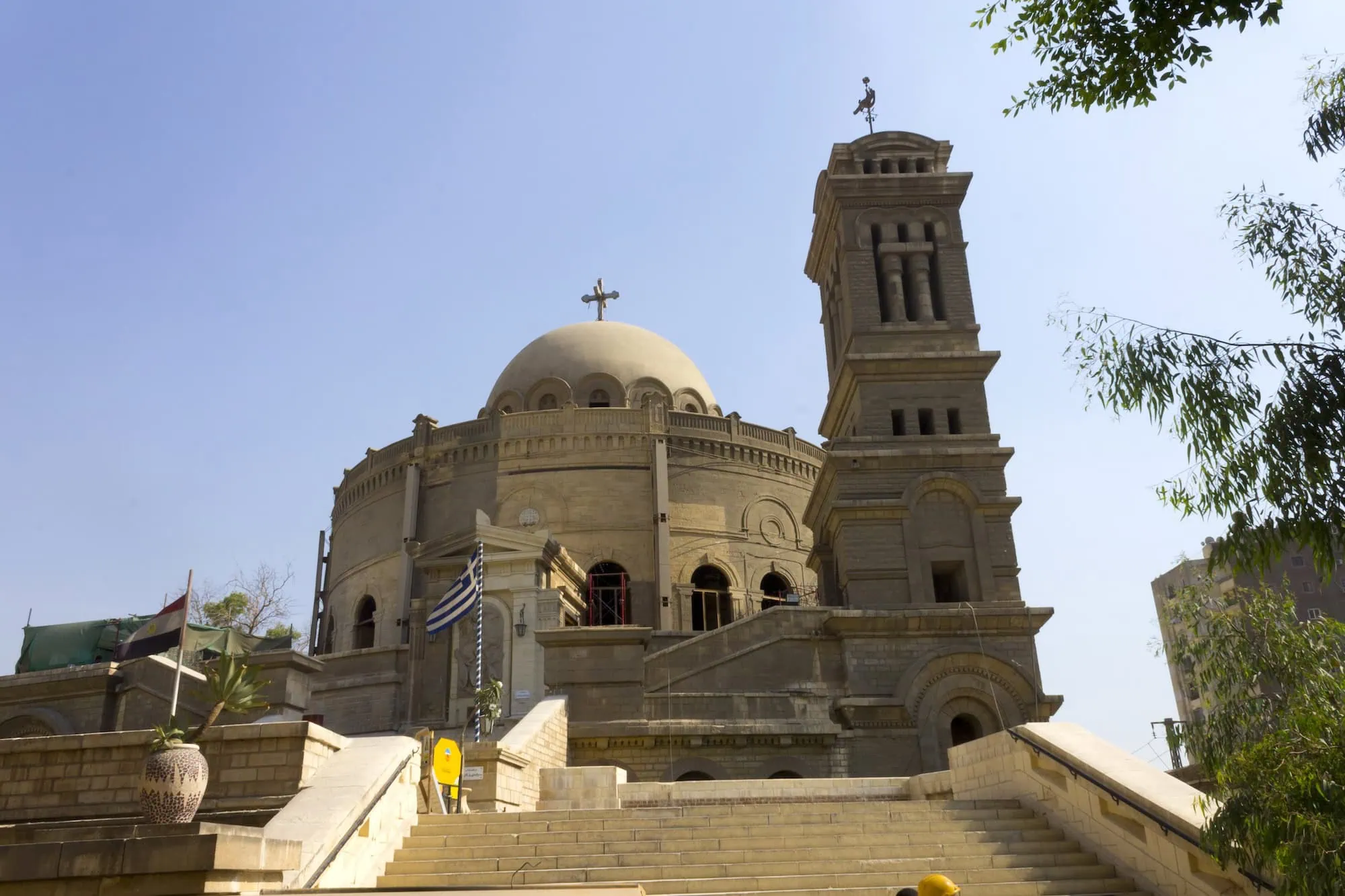 Coptic Orthodox Church with bell tower, dome, and cross in Cairo