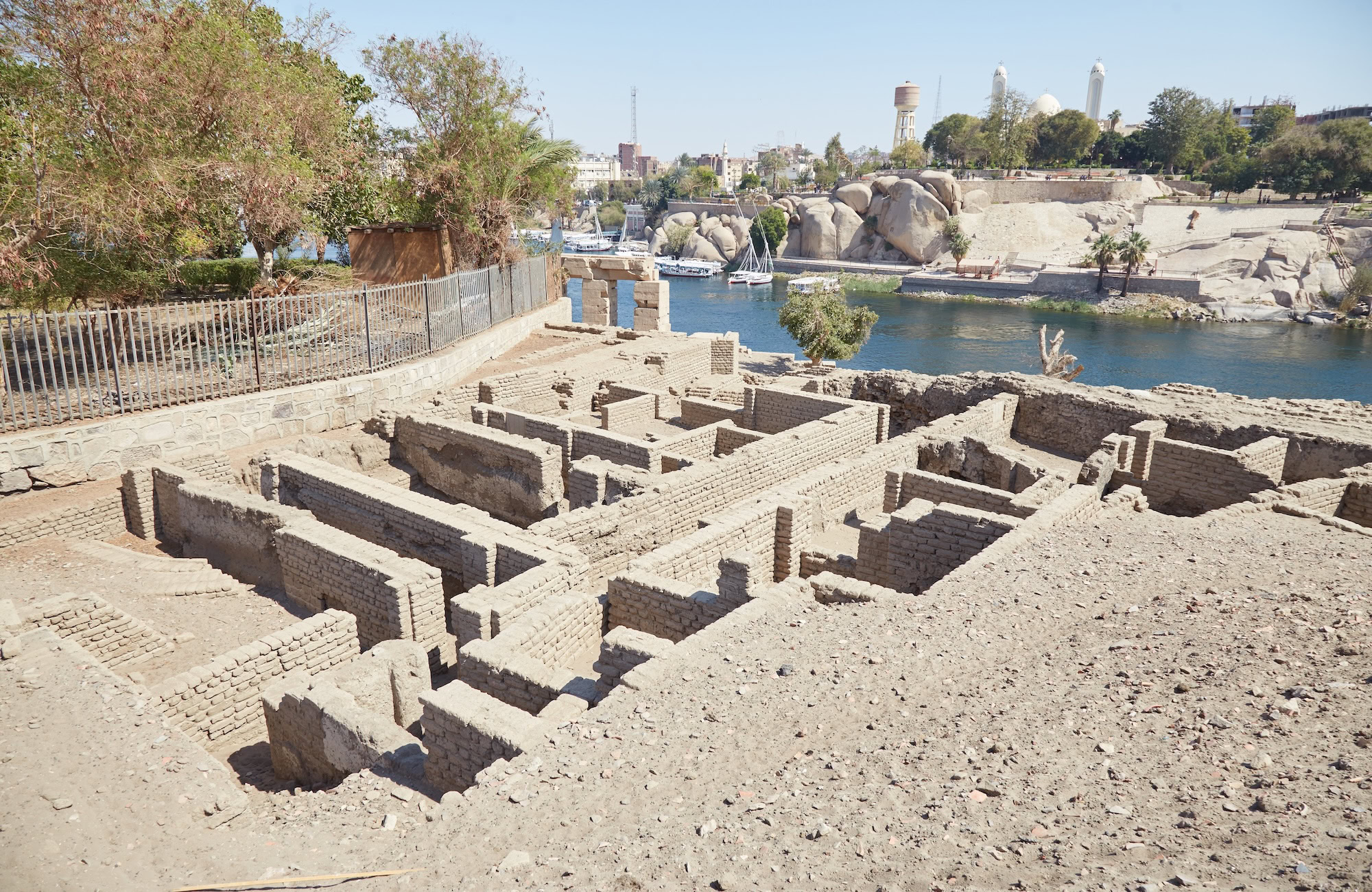 Archaeological excavation site at Elephantine Island showing ancient ruins and preservation work near the Nile River