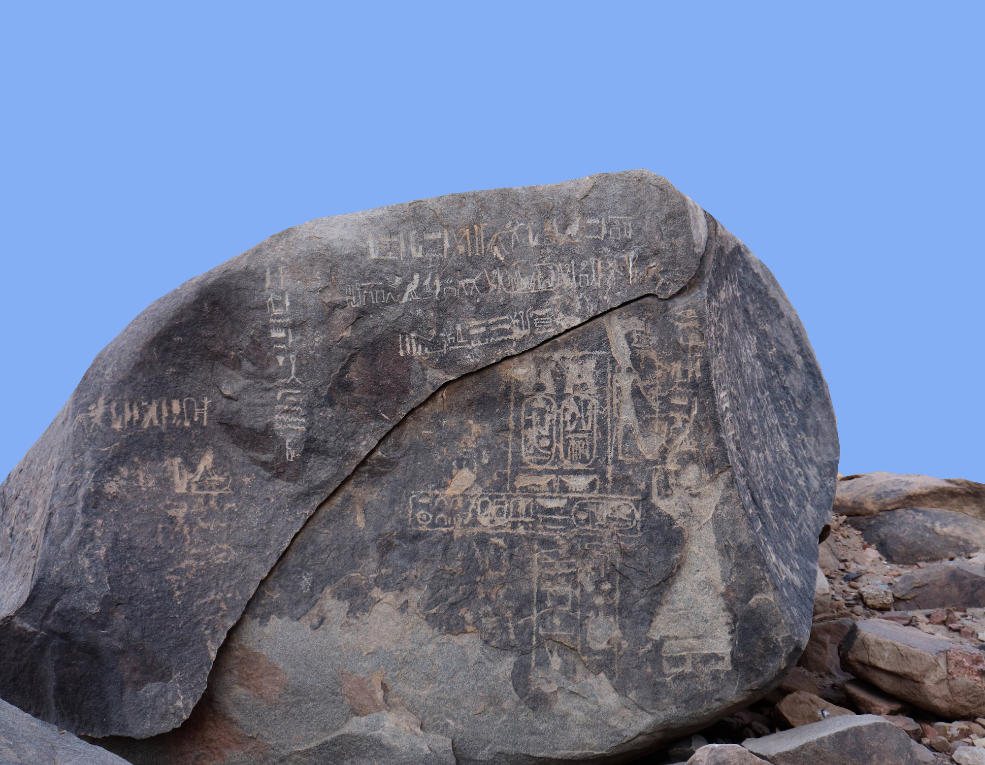 Ancient petroglyphs and rock carvings on boulder surface