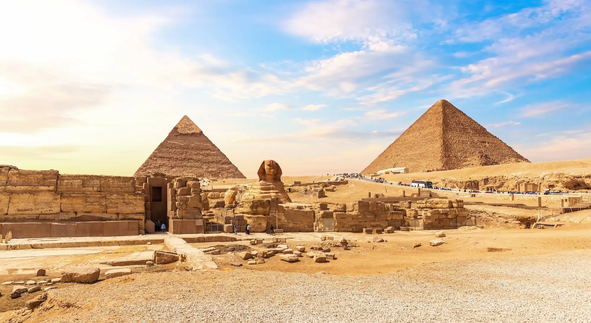 Great Pyramids of Giza and Great Sphinx in Egypt under cloudy skies