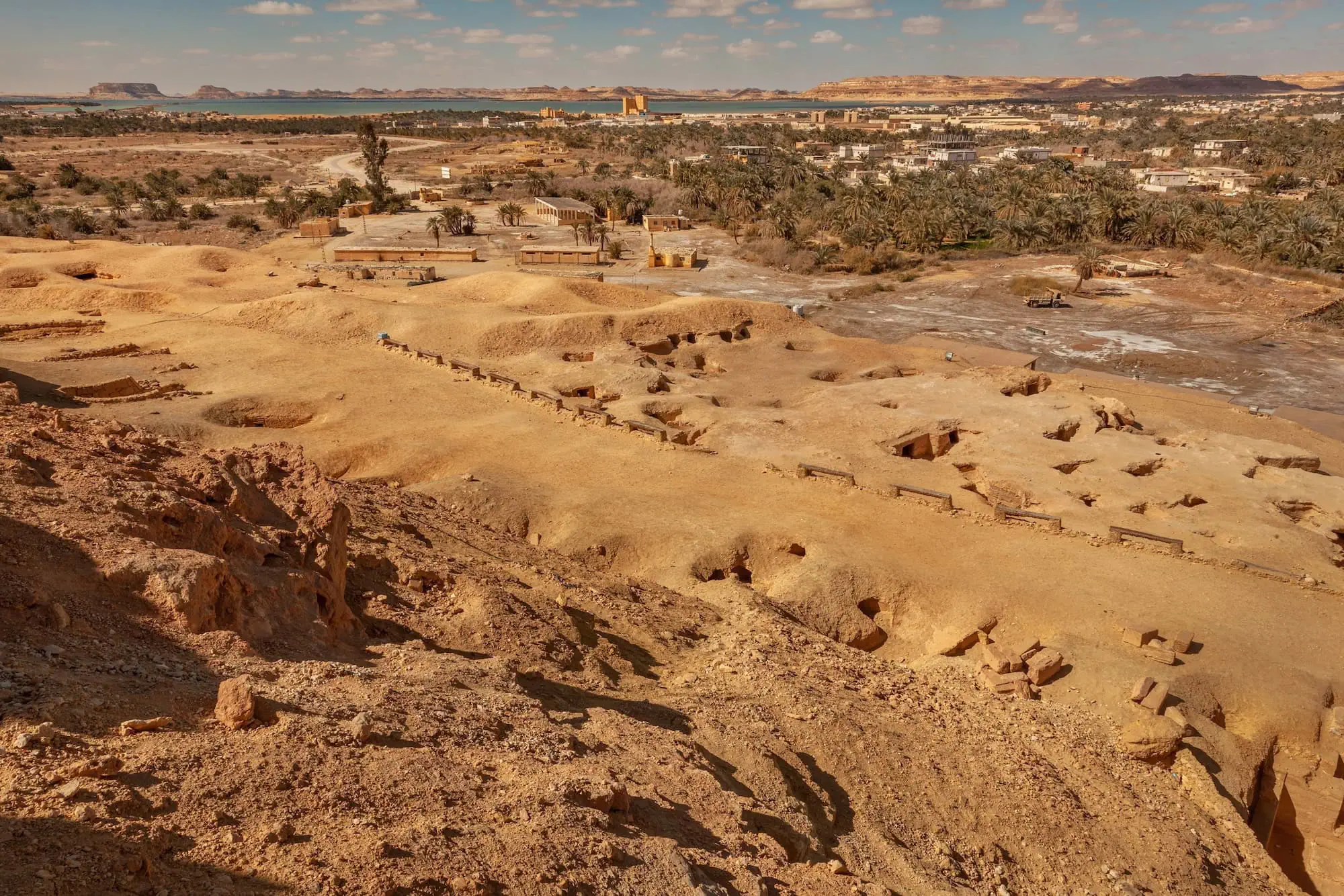 Archaeological excavation site at Tell El Amarna with ancient ruins and desert landscape