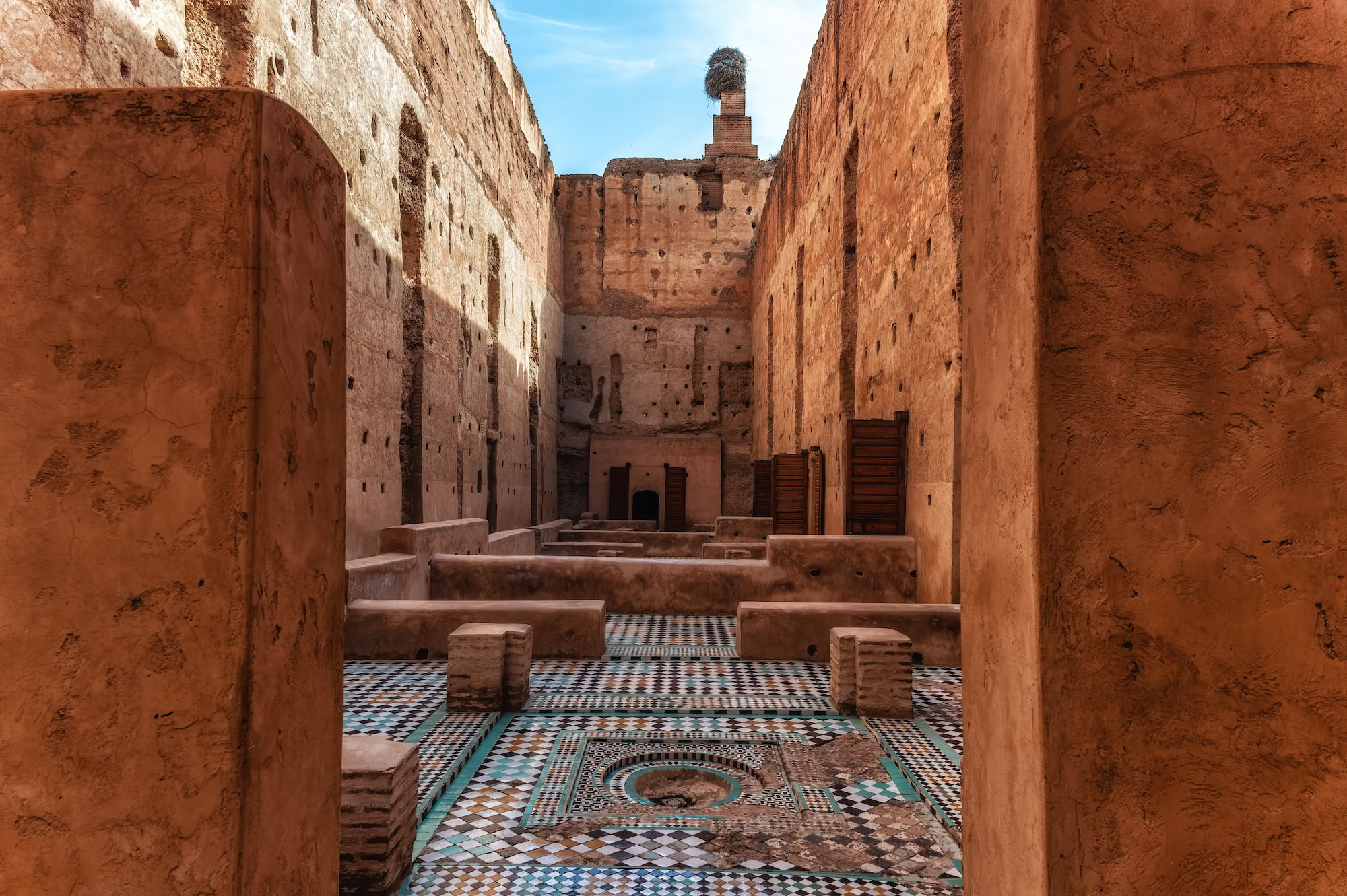 El Badi Palace ruins showing intricate mosaic tiles, archways and geometric patterns in Morocco