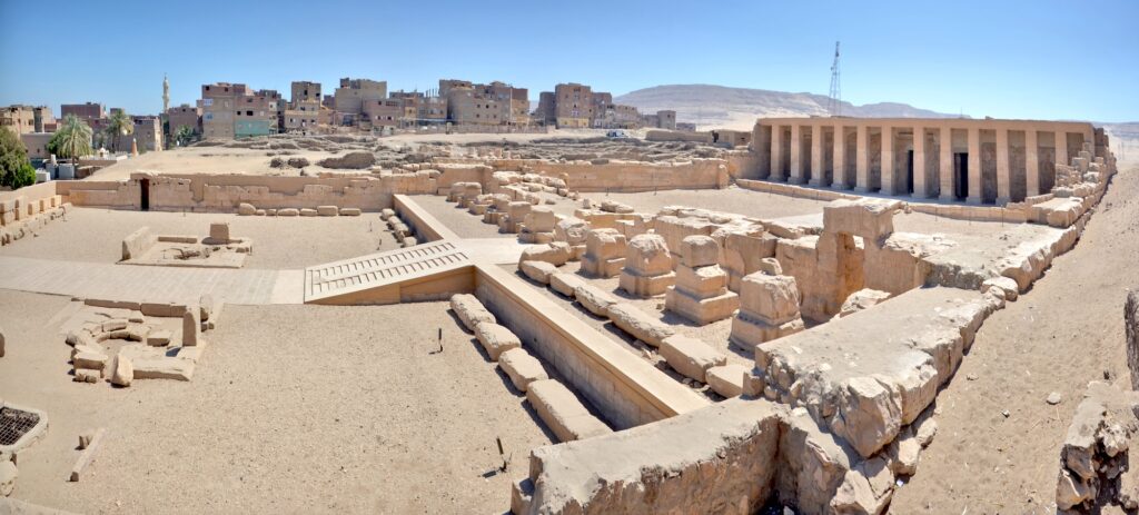 Panoramic view of the Temple of Seti I and the Temple of Ramesses II with stone walls and open courtyards at Abydos