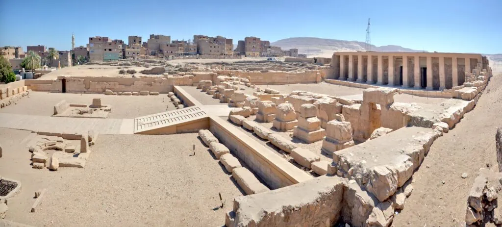Panoramic view of the Temple of Seti I and the Temple of Ramesses II with stone walls and open courtyards at Abydos
