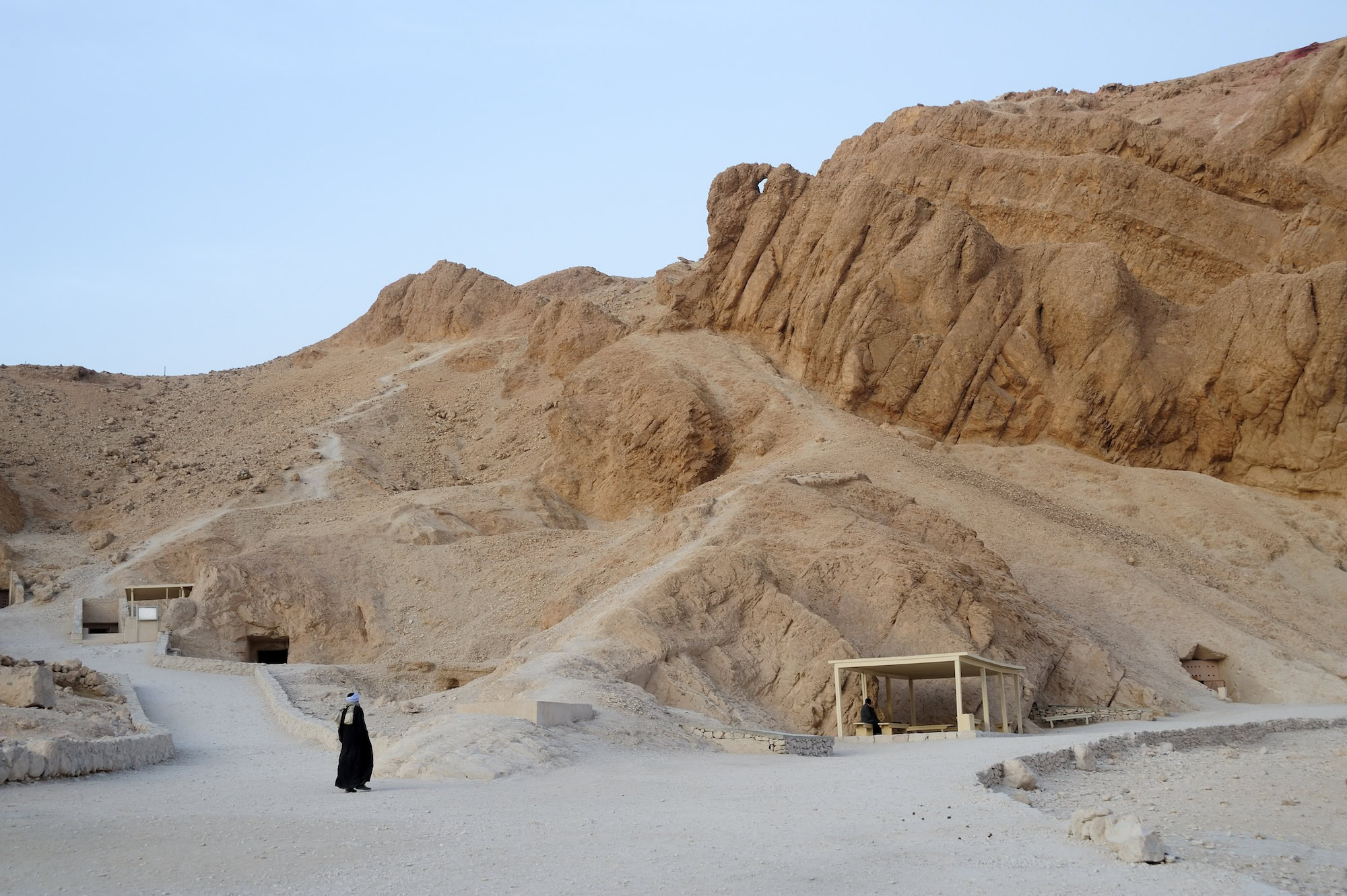 Valley of the Kings tomb entrance in desert cliffs with protective shelter