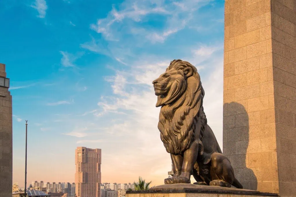 Lion statue decorating the Qasr El Nil Bridge connecting downtown Cairo with Gezira Island, Qasr El Nil Bridge, Cairo