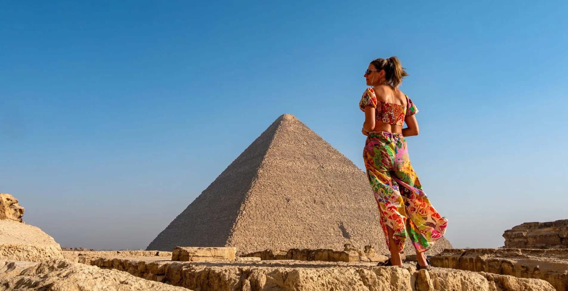 The pyramids of Giza in Egypt with a girl in front