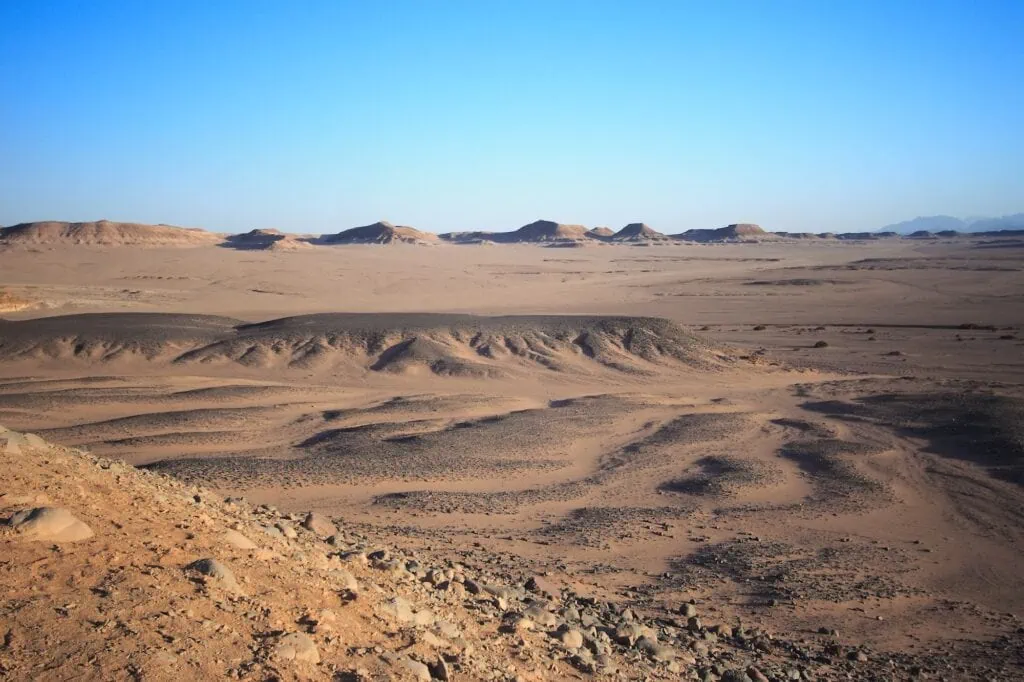 A vast arid landscape of sand and rock in the Western Desert, Farafra