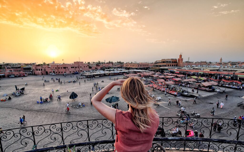 Tourist watching over Jamaa el Fna Market Marrakesh Morocco