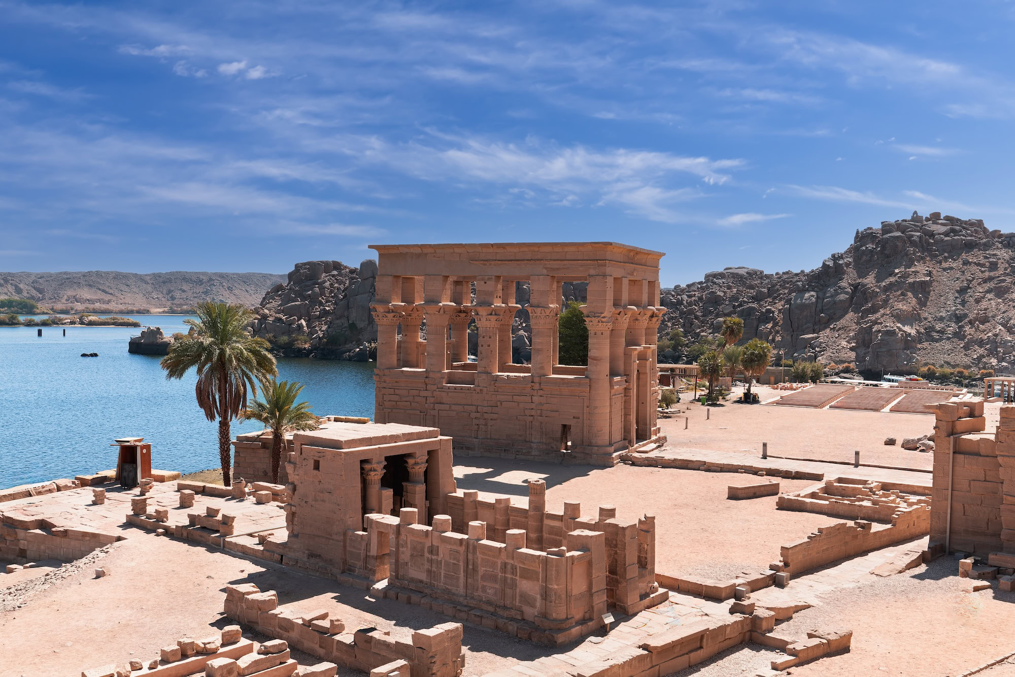 Temple of Philae ancient columns and stone structures beside Lake Nasser in Aswan