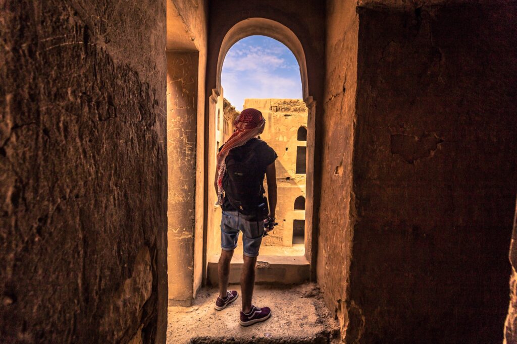 Travelers at the ancient castle of Qasr al Azraq in Jordan