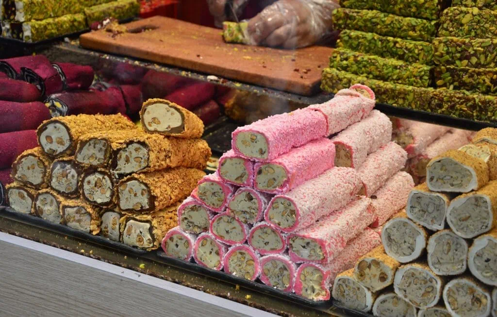 Turkish delight stacked on a colorful market stall in Istanbul