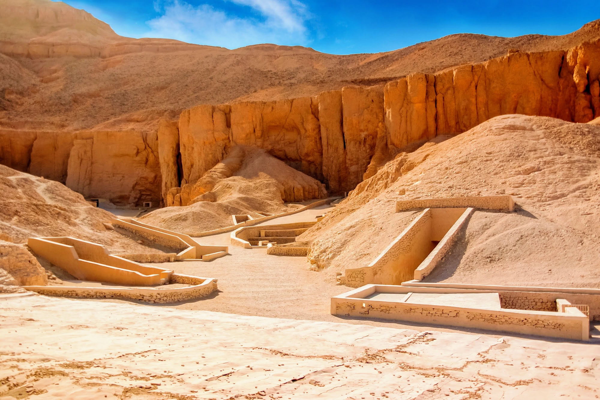 Ancient tombs and limestone cliffs in Valley of the Kings archaeological site