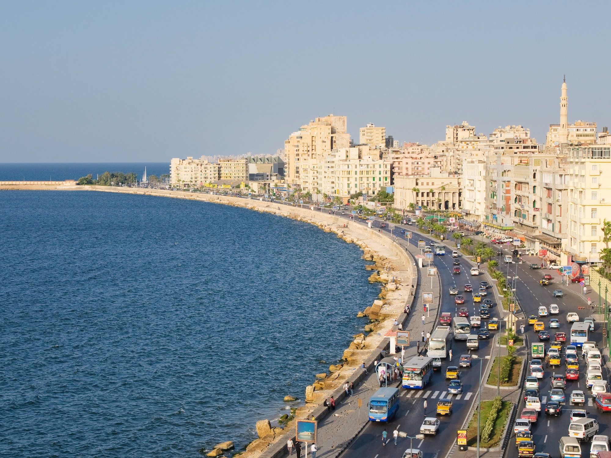 Aerial view of Alexandria's Mediterranean coastline showing the curved waterfront and urban development