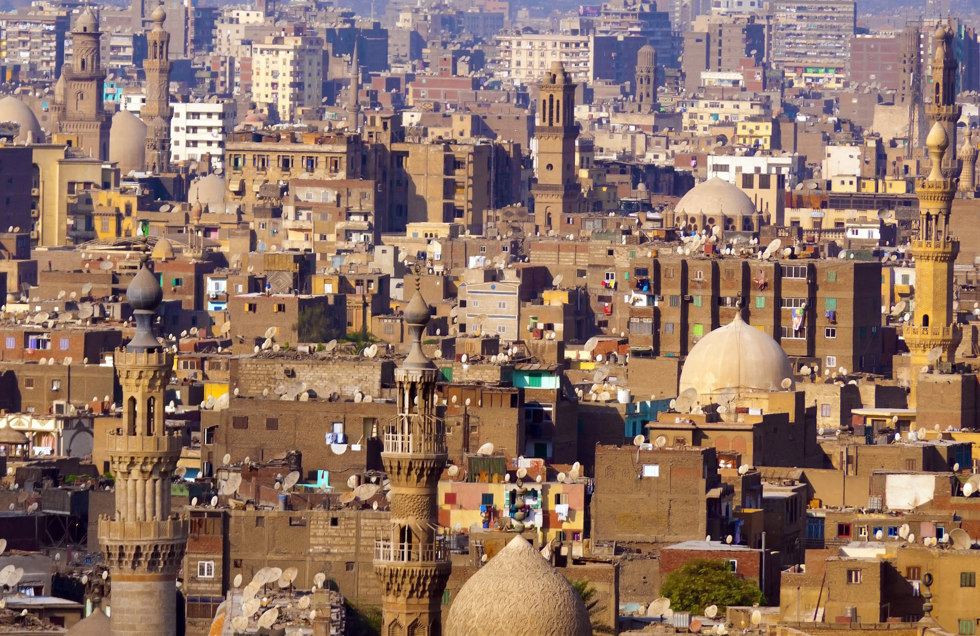 Historic Islamic architecture in Cairo showing mosque domes and minarets