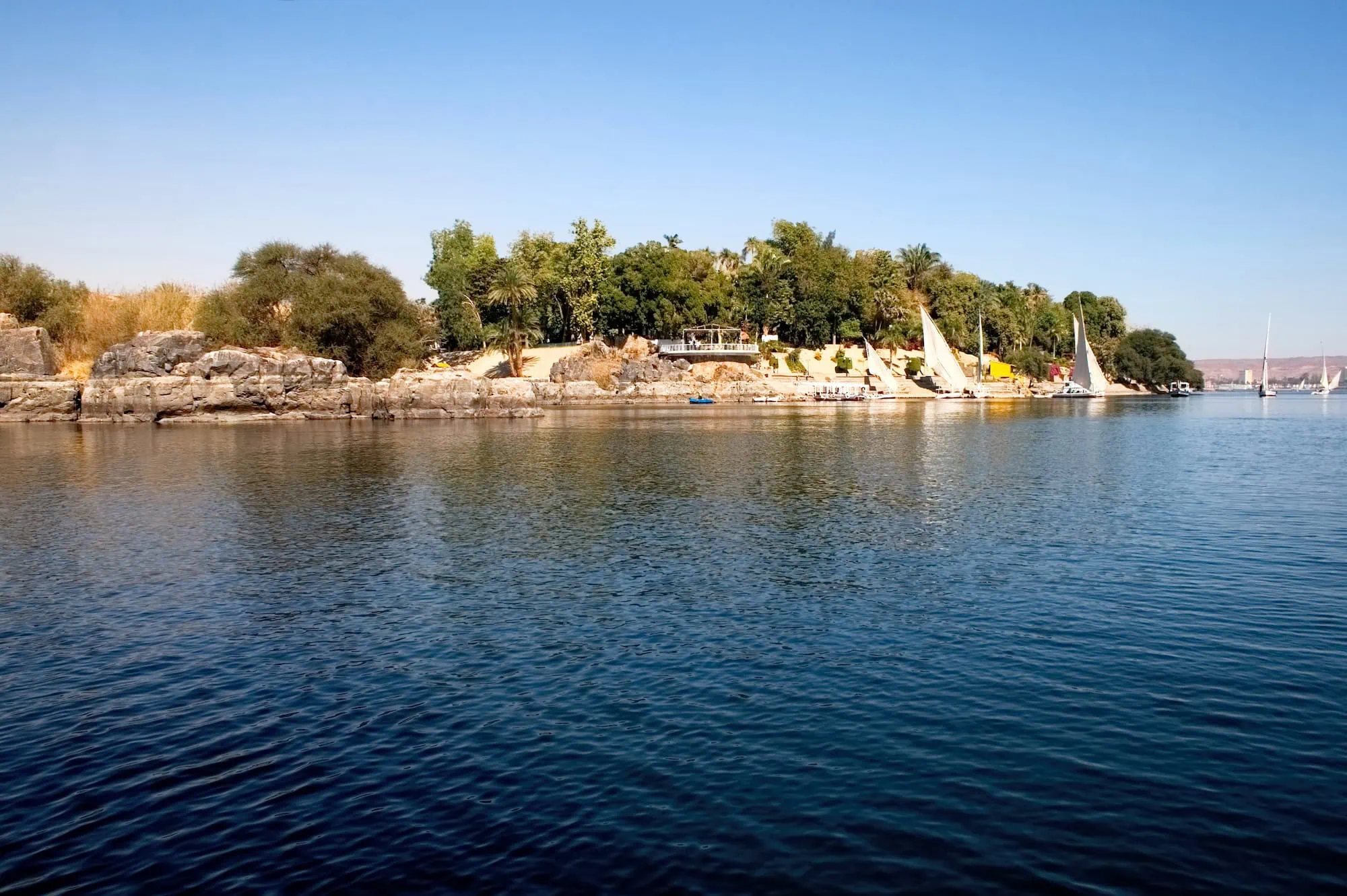 Elephantine Island on the Nile River with ancient ruins and traditional felucca boats