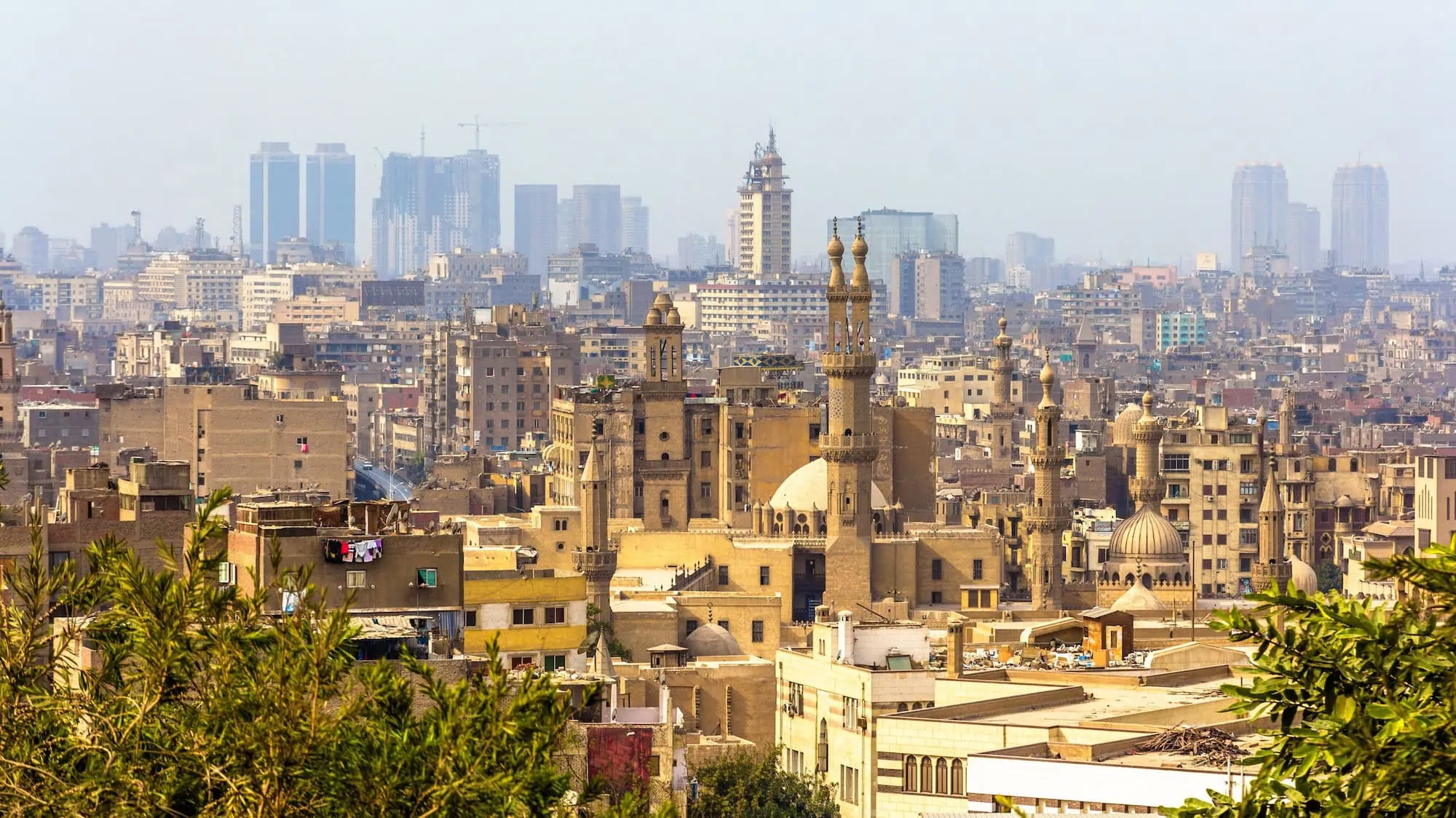 Panoramic view of Islamic Cairo showing historic mosques, minarets and traditional architecture