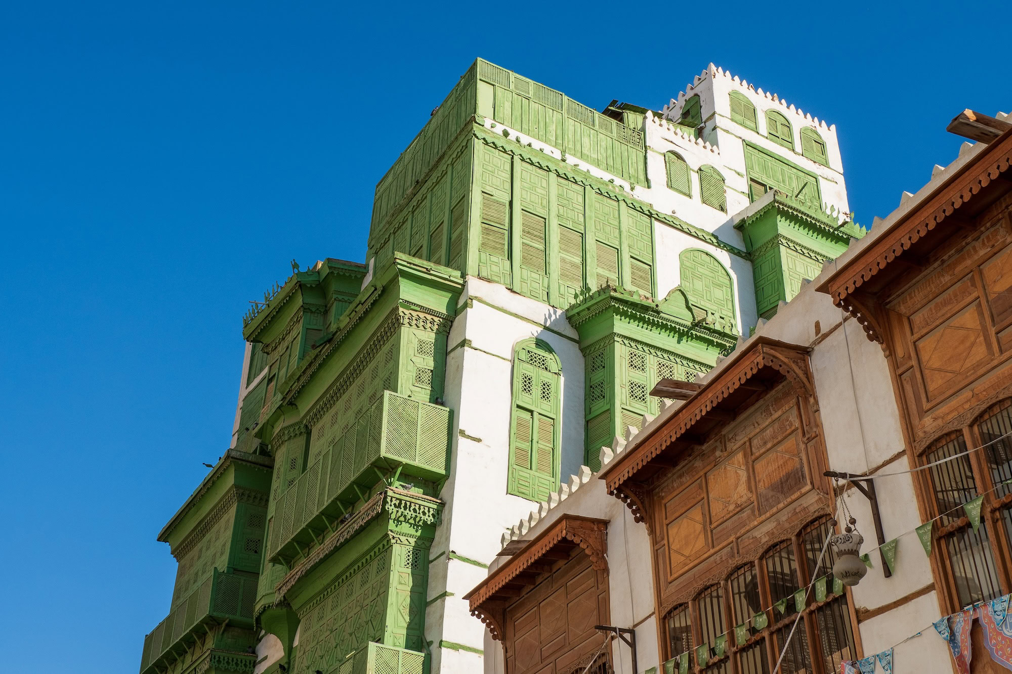 Traditional Ottoman coral houses with ornate wooden balconies in Al-Balad, Jeddah
