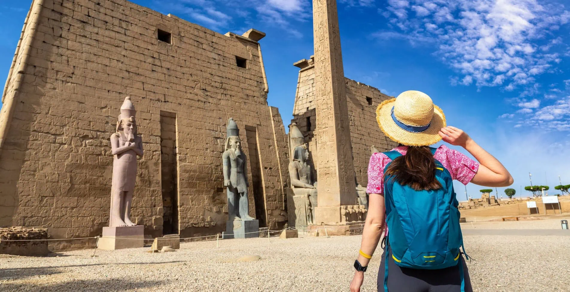 Woman tourist at Luxor Temple in a sunny day Luxor Egypt 1905x976 crop 53 66