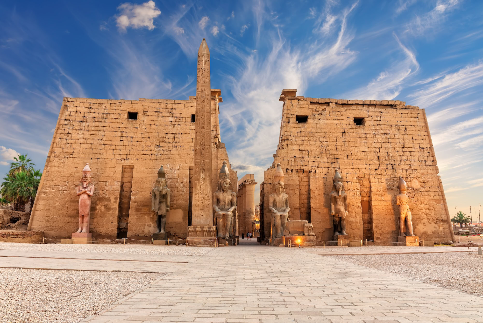 Luxor Temple with ancient obelisk, sphinx statues, and stone columns in Egypt