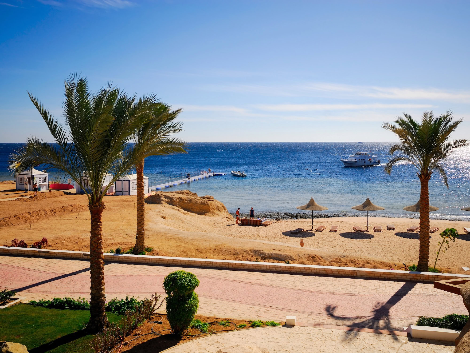Red Sea resort with palm trees, beach, and pier in South Sinai