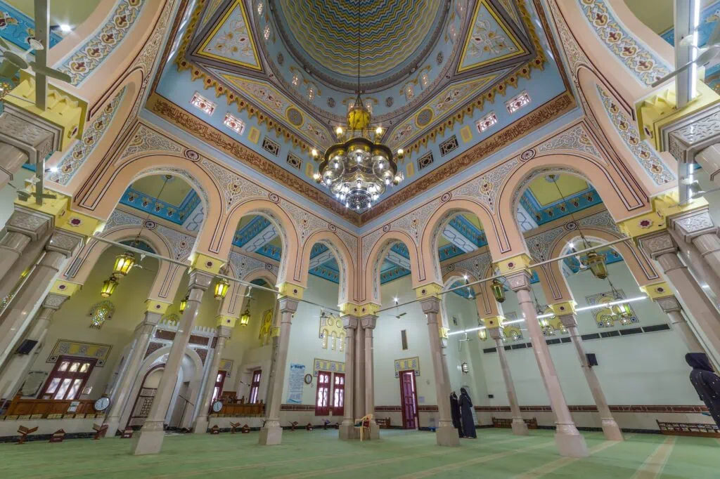a large ornate building with columns and a chandelier