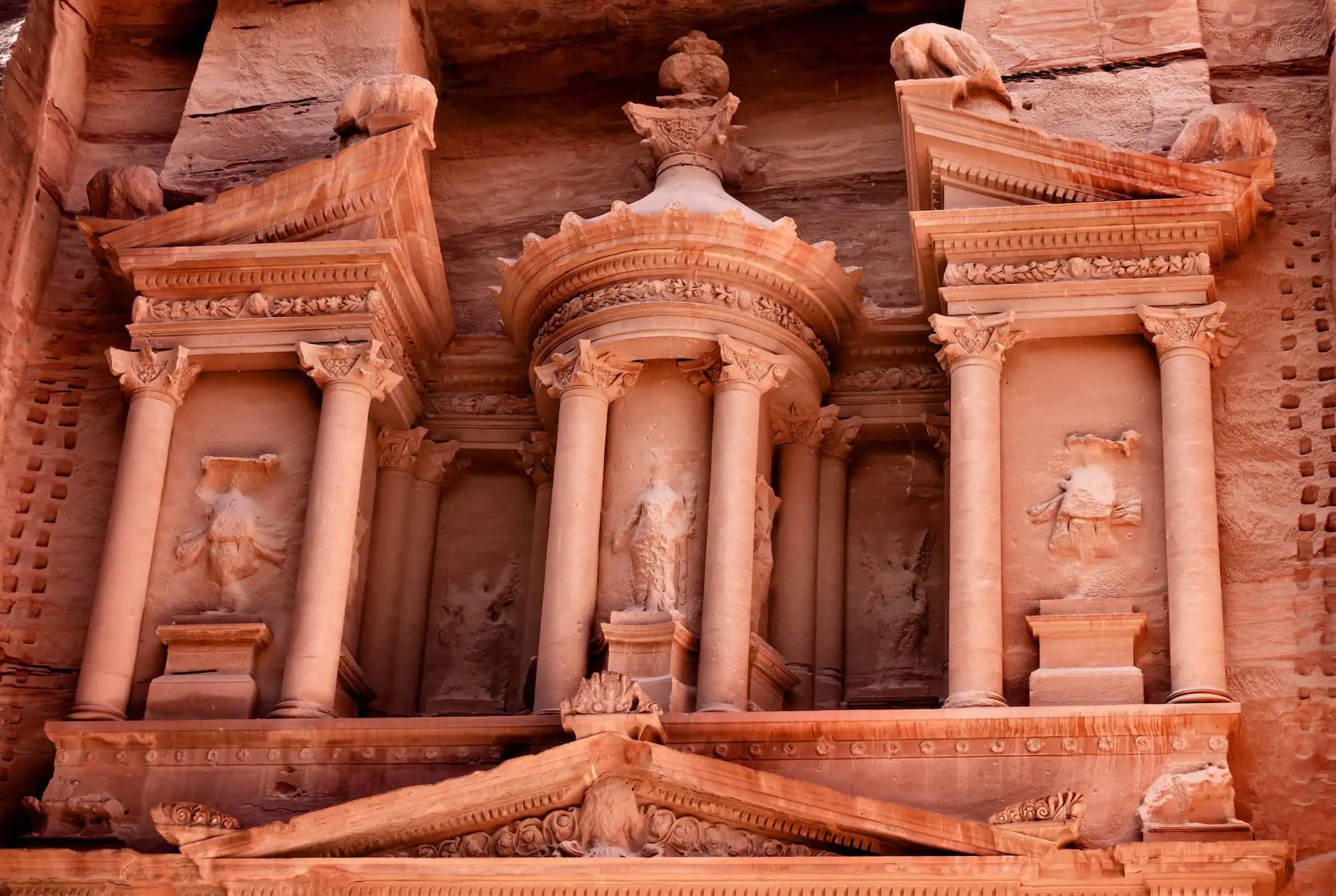 Detailed view of the Treasury facade in Petra showing intricate Nabataean stone carvings