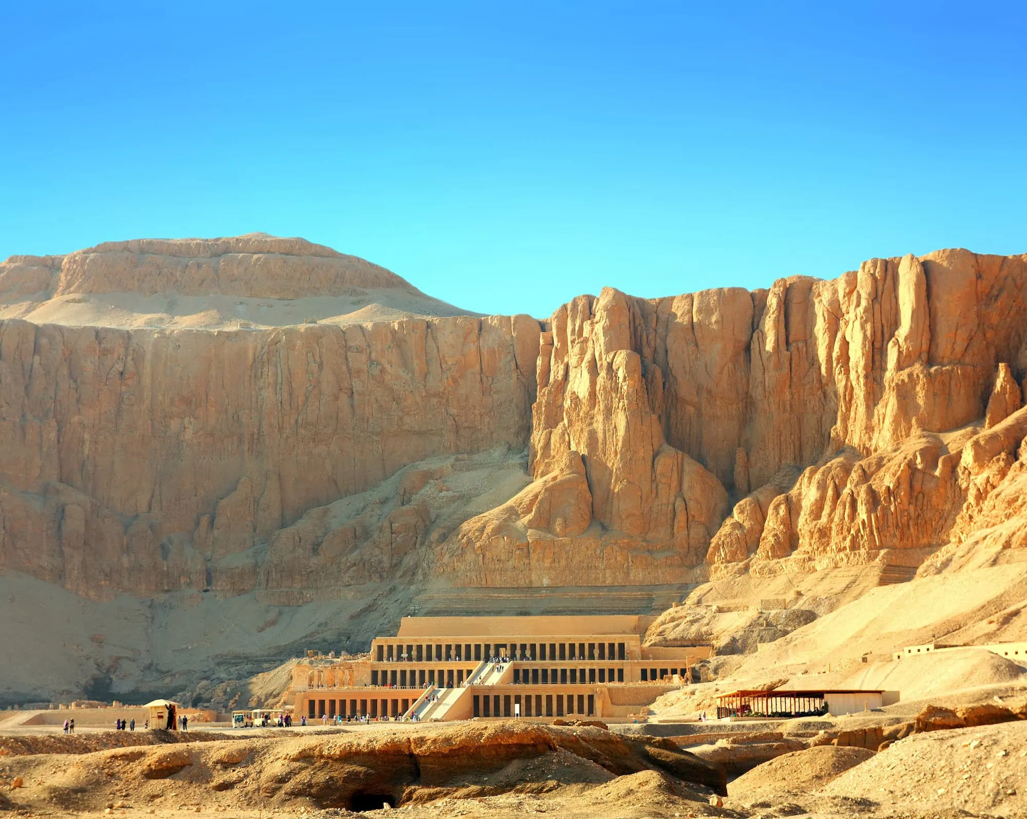 Mortuary Temple of Queen Hatshepsut with terraced architecture against limestone cliffs in Luxor