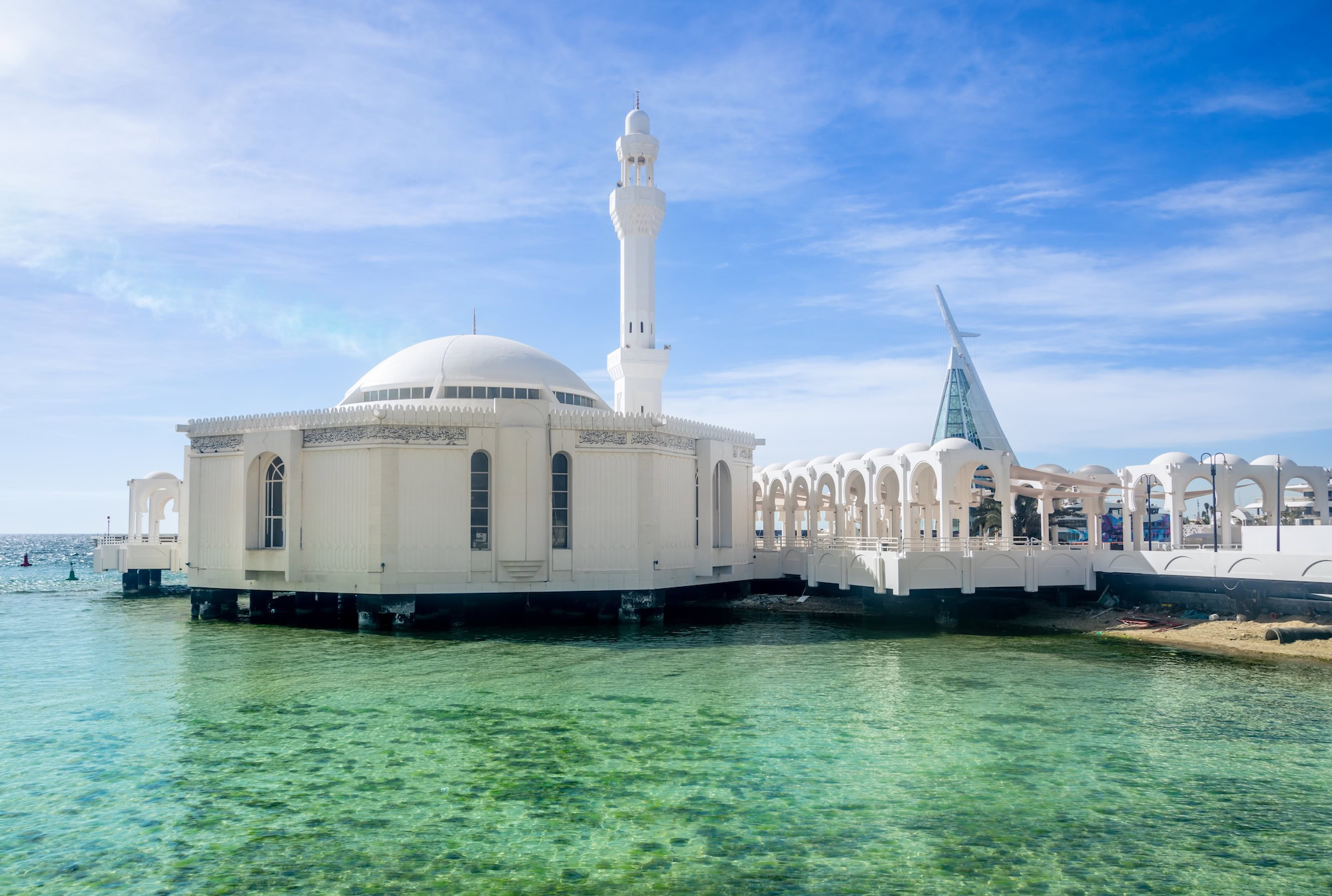 Al Rahma Floating Mosque in Jeddah with white domes and minarets over water