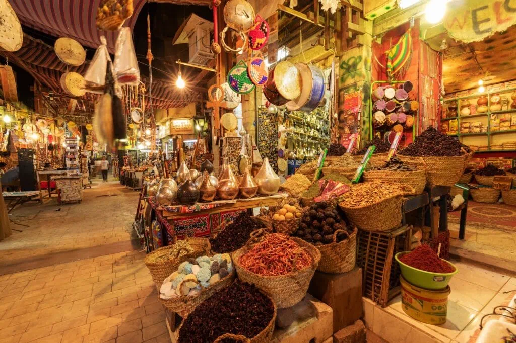 Vendors and stalls inside a covered market hall near Luxor Temple, Luxor
