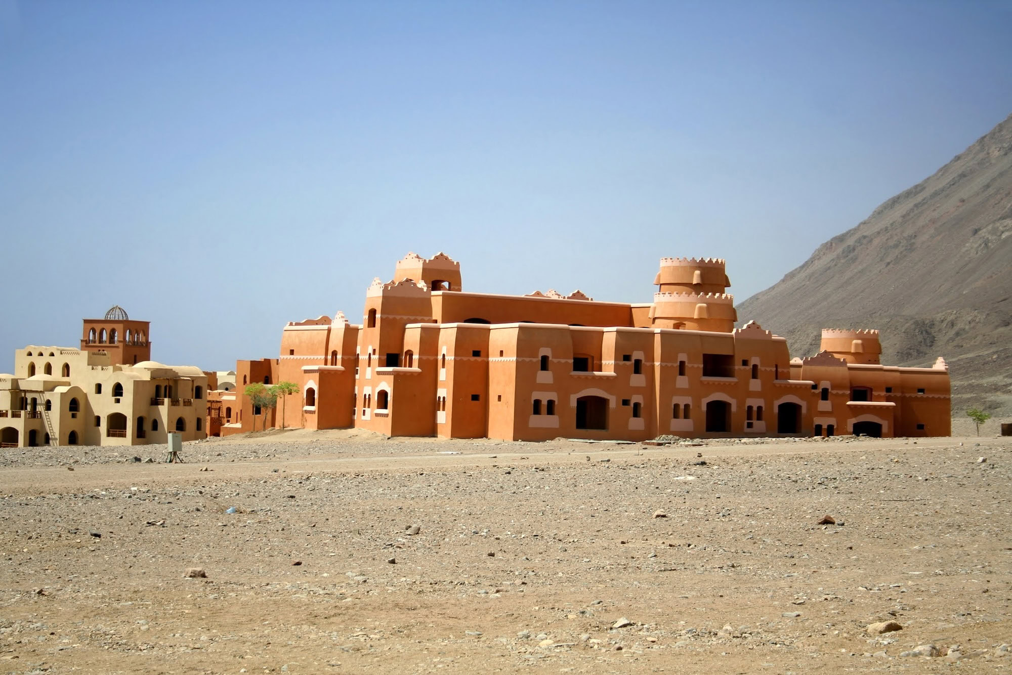 Traditional desert fort with towers, walls and courtyards showcasing historical architecture and craftsmanship