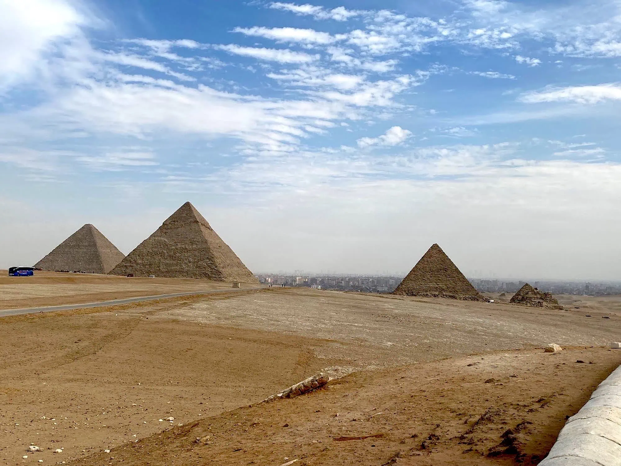 Panoramic view of the Pyramids of Giza complex in the desert