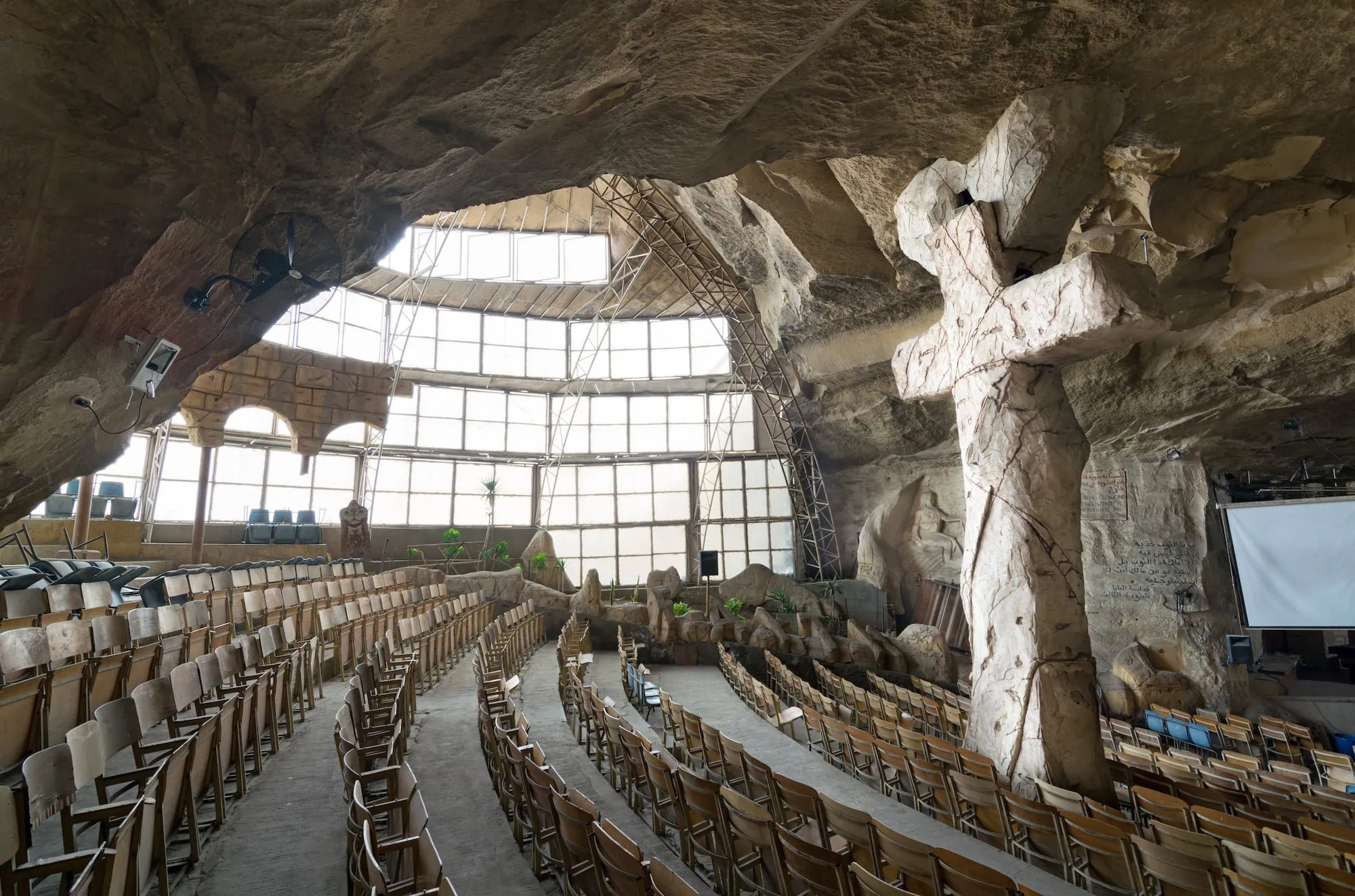 Interior of Cave Church of Saint Simon the Tanner showing carved stone walls and religious elements