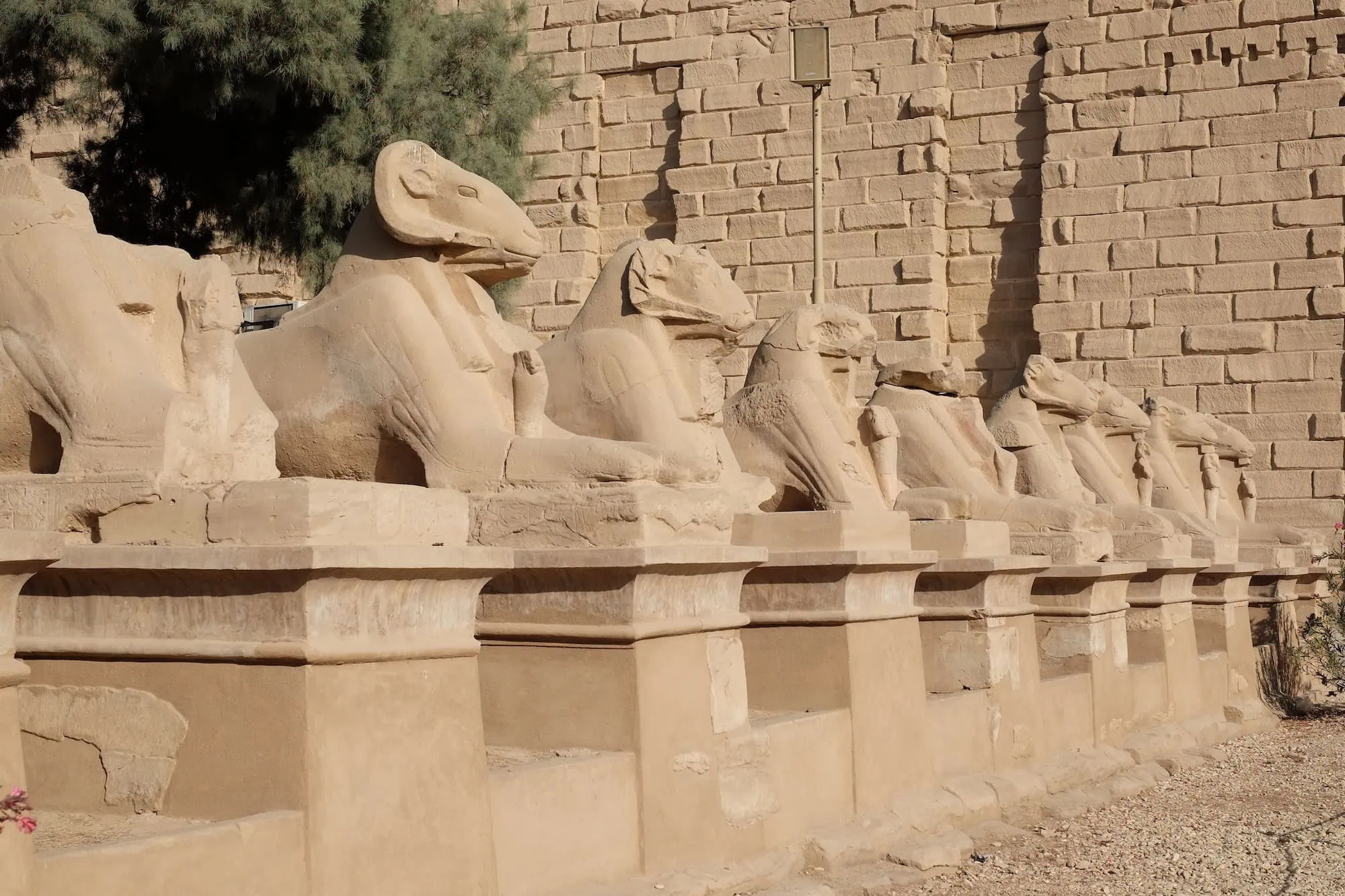 Ram-headed sphinx statues lining the Avenue of Sphinxes at Karnak Temple complex