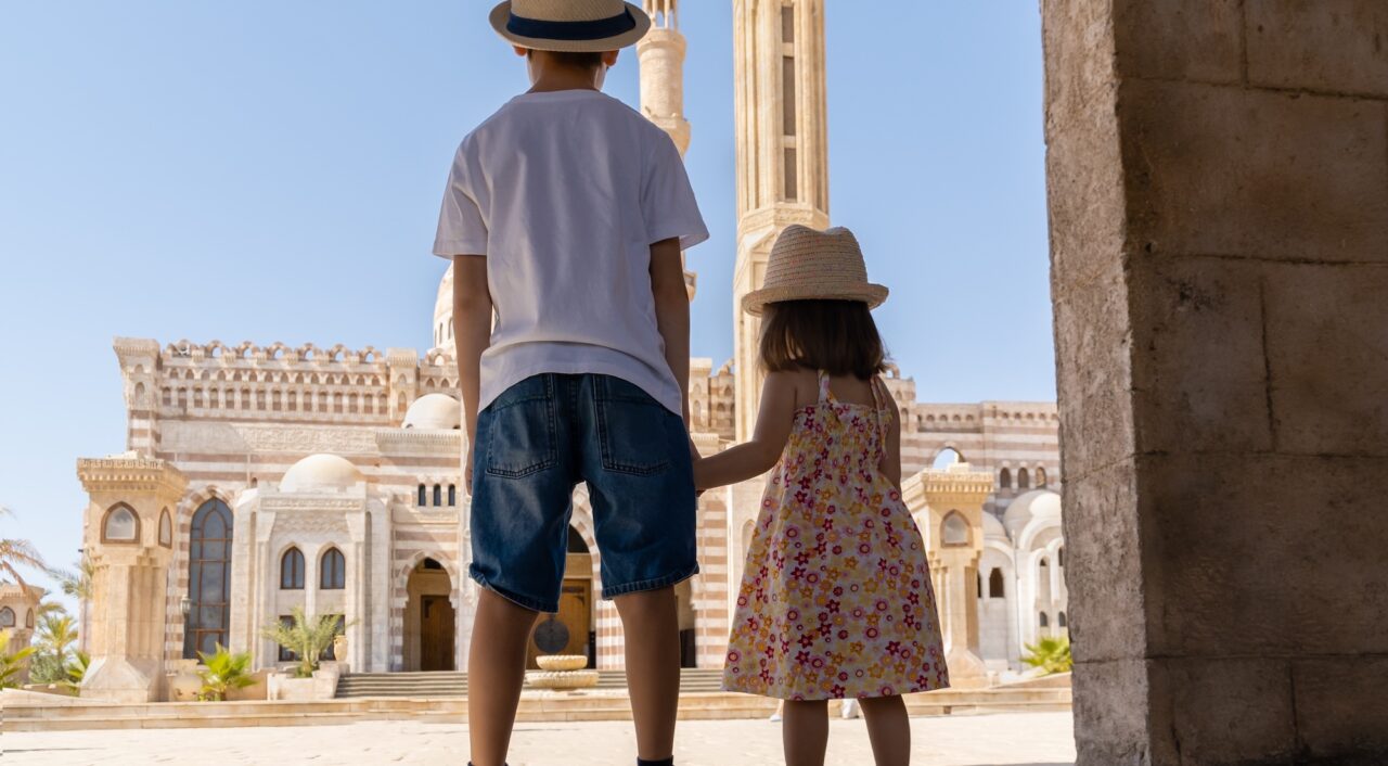 A boy and a girl standing in front of El Mustafa Mosque, Sharm El Sheikh