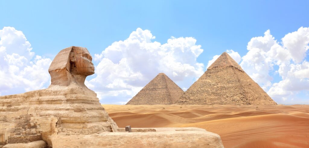Great Sphinx with the pyramids of Chephren and Cheops visible in the Giza Plateau, Giza