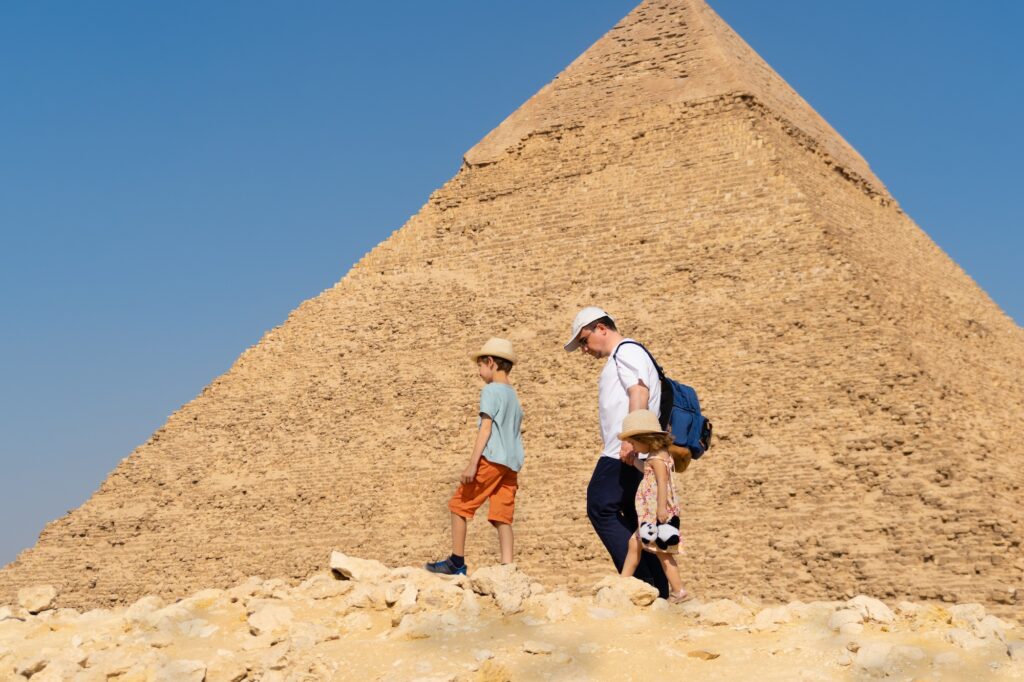 Father and son walking across the Giza Plateau with the Pyramid of Khafre in the background, Pyramid of Khafre, Giza