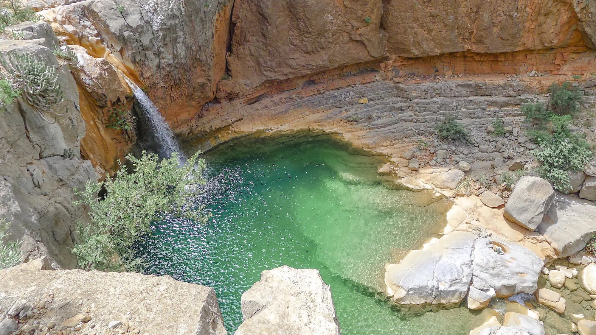Crystal-green lagoon surrounded by dramatic rock walls in Paradise Valley near Agadir
