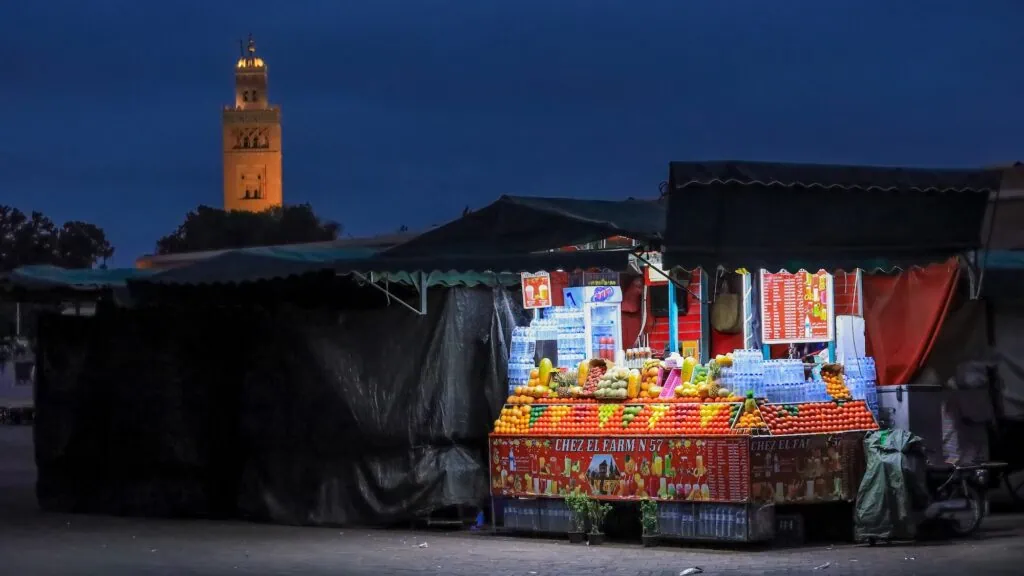 Jemaa el Fna square before sunrise with open space and surrounding medina buildings, Marrakesh