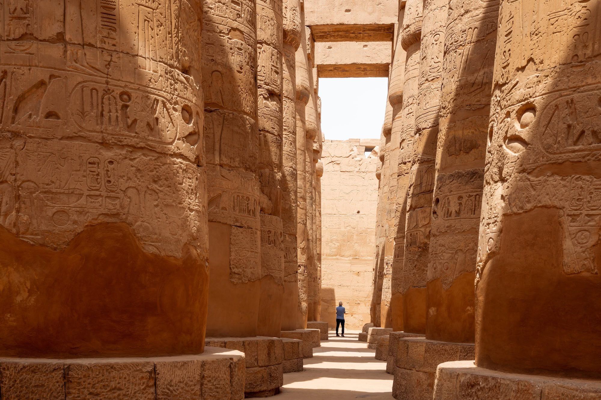 Massive ancient columns with hieroglyphics at Karnak Temple Complex showing architectural details