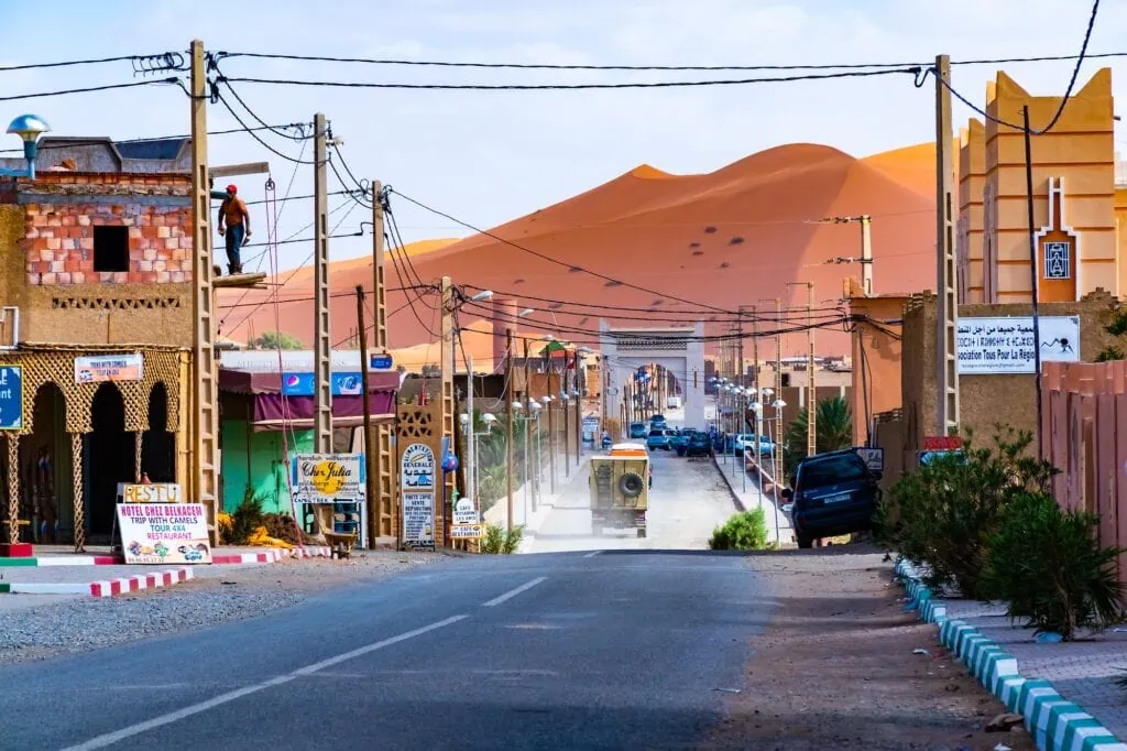 Merzouga village with earthen Berber buildings and desert surroundings, Merzouga