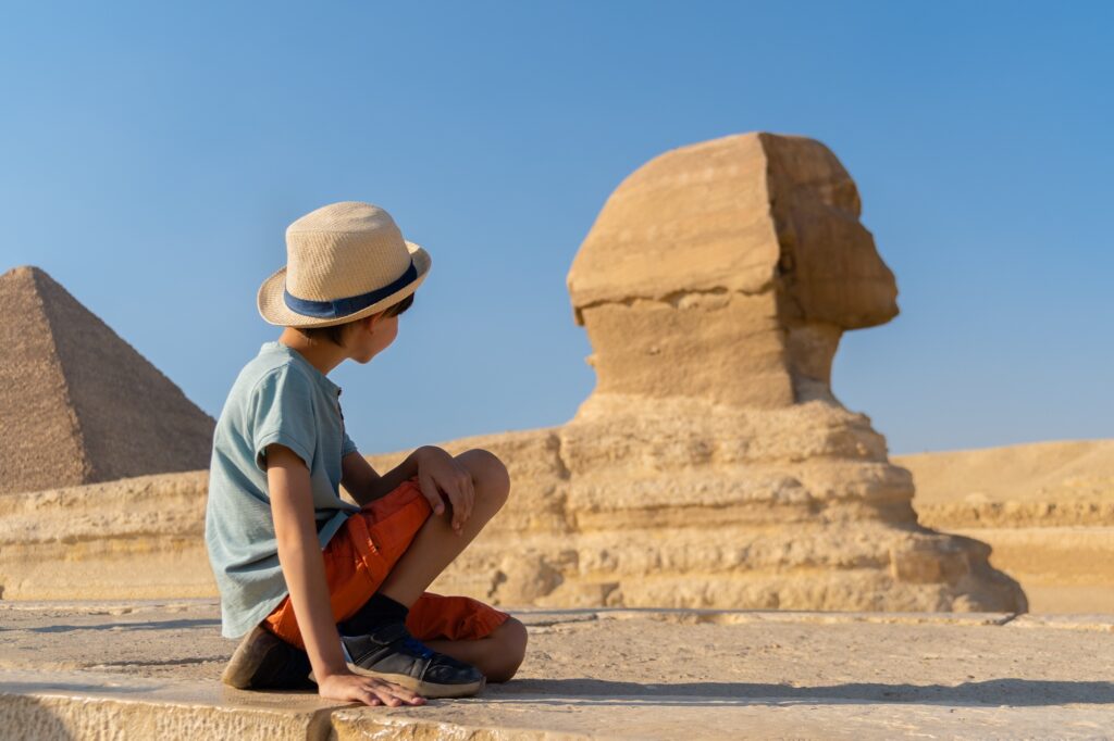 Boy seated before the Great Sphinx