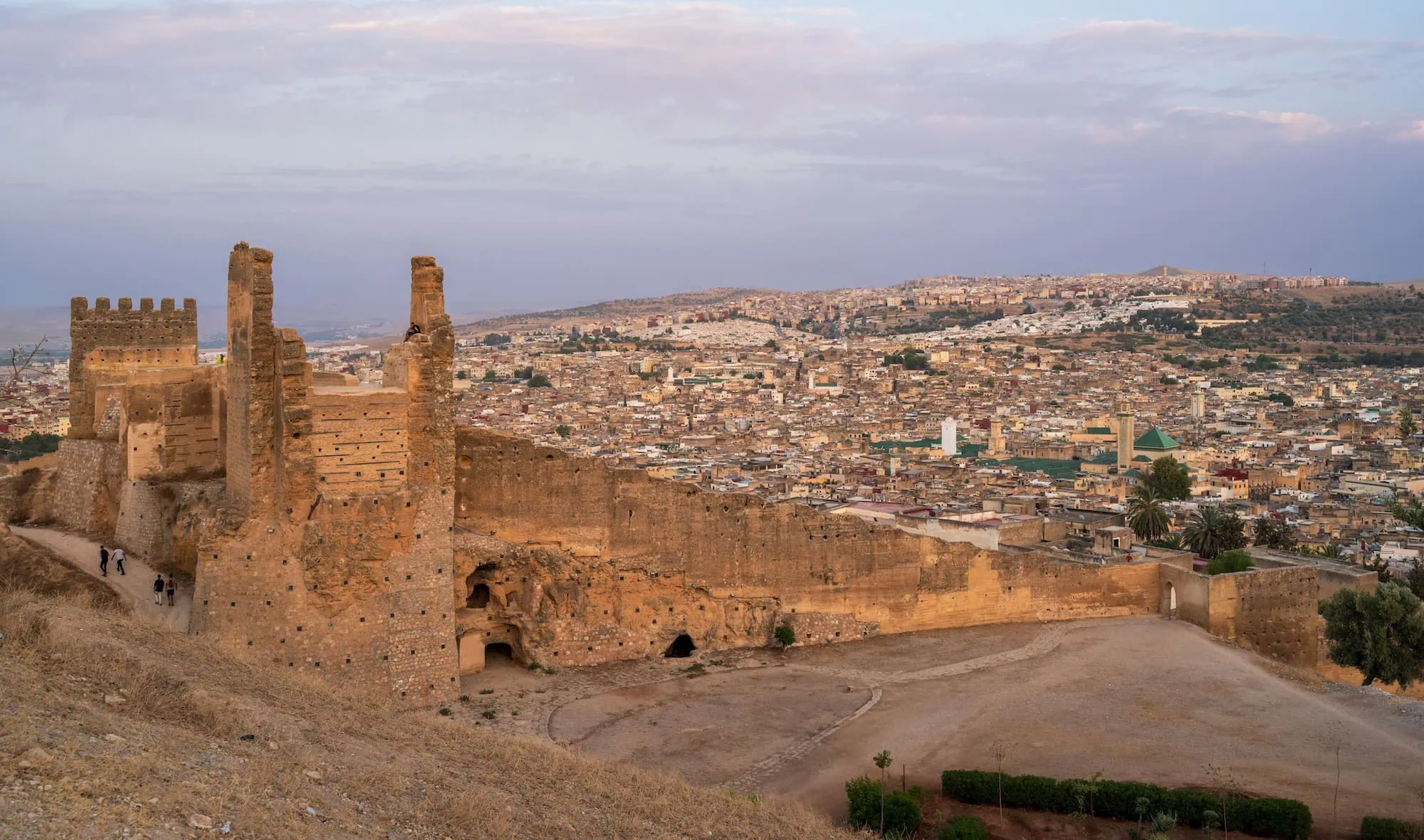 Panoramic view of Fez from ancient Marinid Tombs ruins during golden hour