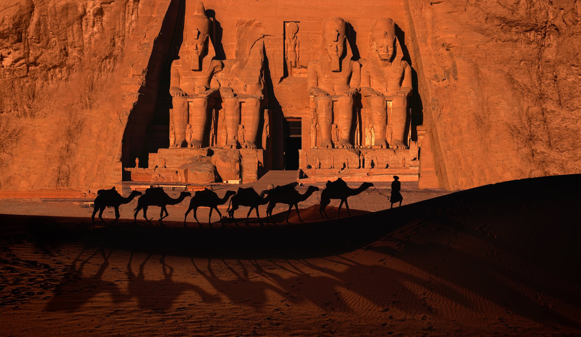 Great Temple of Ramesses II with colossal seated statues carved into the rock façade, Abu Simbel