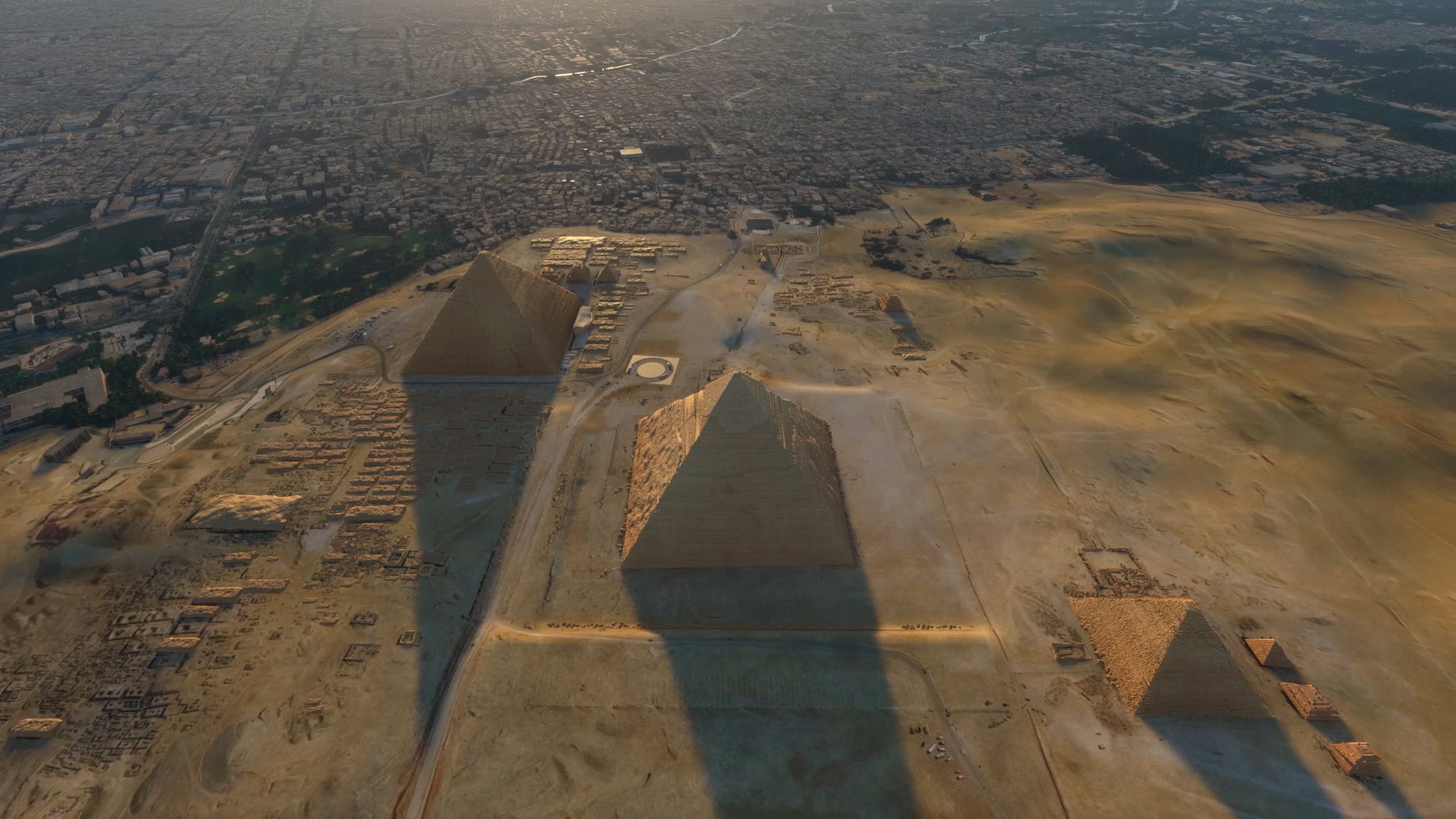 Aerial view of the Great Pyramid of Giza showing surrounding roads and urban development