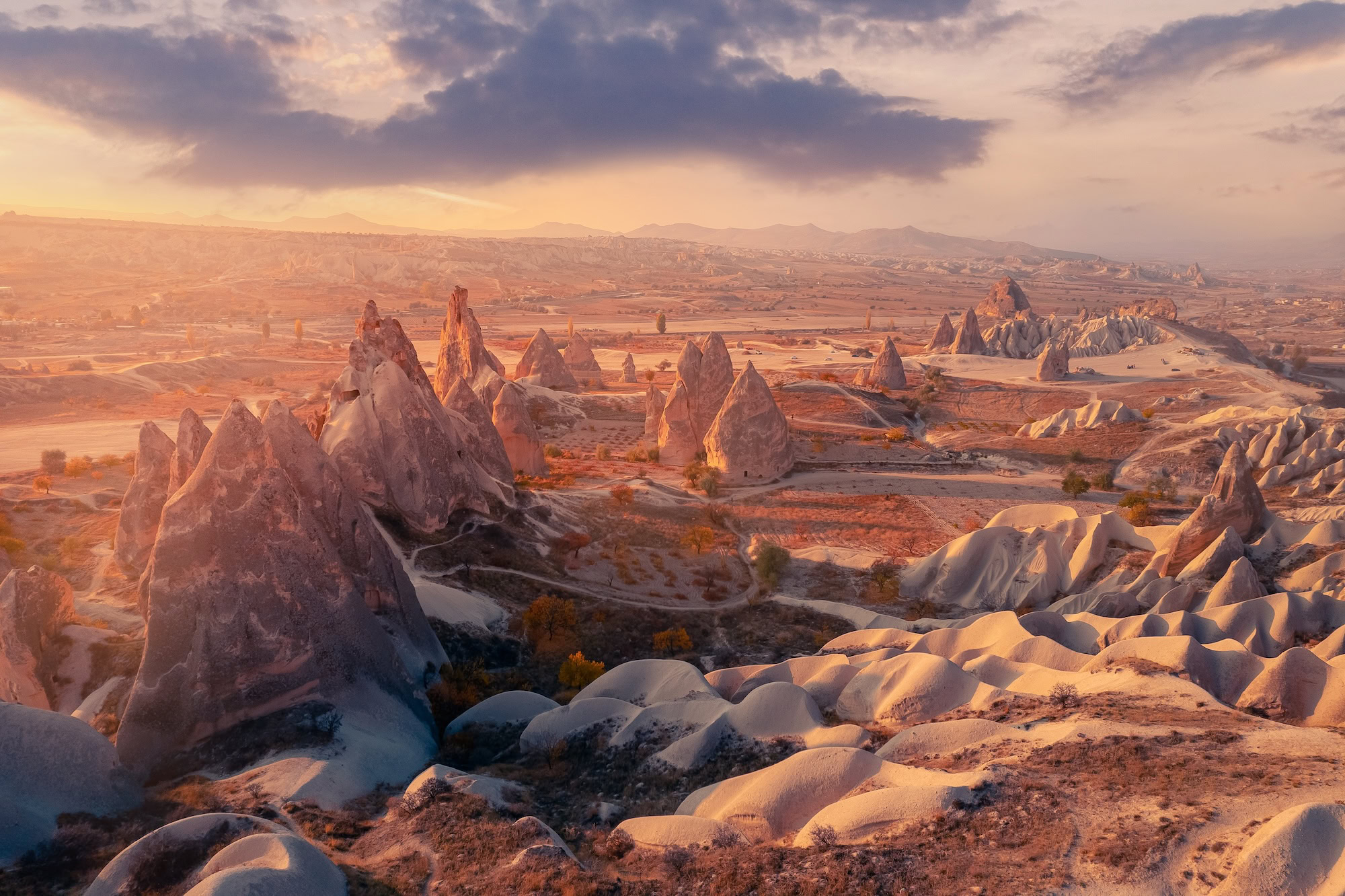 Aerial top view Sunset landscape Cappadocia stone and old cave house in Goreme national park Turkey sunlight