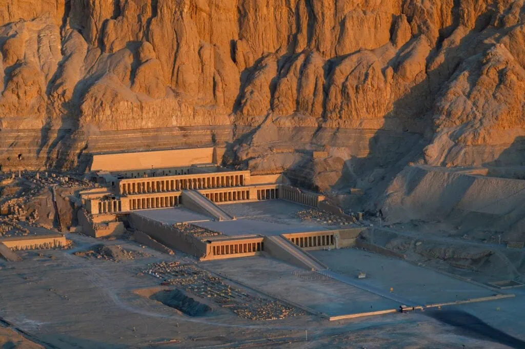 Aerial view of the Temple of Hatshepsut at sunrise in the Valley of the Kings